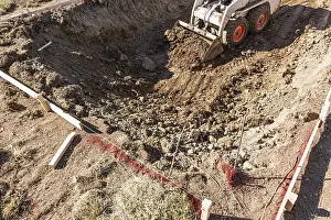 Bulldozer Construction Site Prints: Small bulldozer digging in yard for pool installation