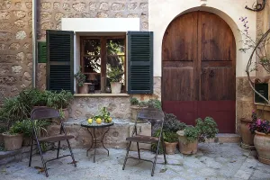Spanish Architecture Photography Prints: Small courtyard with table and chairs