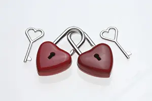 Romanticism Concept Prints: Two small red padlocks are connected