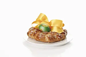 Easter Dessert Photography Prints: Small savarin with Easter egg and bow on a plate