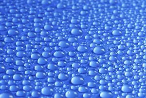 Close Up Macro Photography Prints: Many small water drops on a blue surface