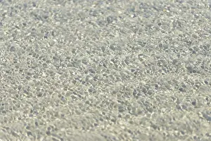 Northern Germany Nature Scene Prints: Small waves on sandy beach with light reflections