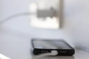 German Power Industry Prints: A smartphone is charged via a socket