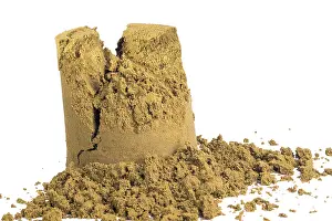 Bright Studio Background Photo Prints: Smashed and destroyed sandcastle