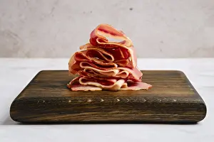 Food Photography Bacon Prints: Smoked bacon pieces stacked in a stack
