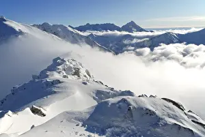Prints of Snow capped summit of Tatry high under clear skies Slovakia Prints: Snow-Capped Tatry Summit Print