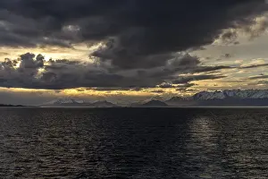 South American Mountain Scenery Prints: Snow-covered mountain range with dramatic cloud vibes at sunset