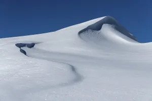 Blue Sky Winter Scene Prints: Snow drift with snow cornice, snow surface with structures with light and shade