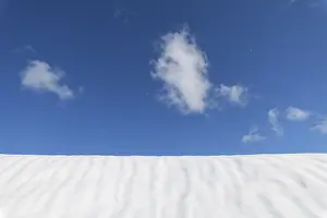 Deserted Snowy Mountain Peak Prints: Snow surface with sky and cloud