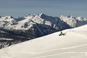 Alpine Adventure Prints: A snowboarder glides effortlessly down a pristine