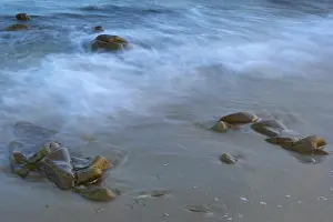 Western Europe Coastlines Prints: Soft waves breaking on a beach