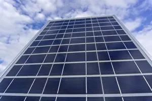 Renewable Energy Prints: Solar panel in sunlight on sky background