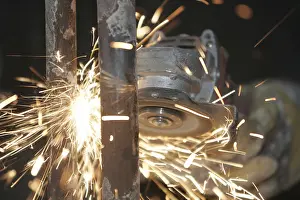 Uninhabited Industrial Area Prints: Sparks while working with a grinder