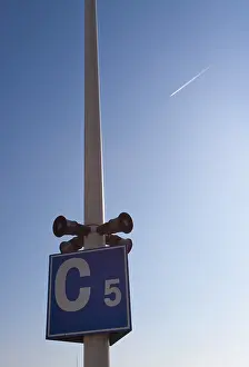 Blue Sky Directional Sign Prints: Speakers on a lamp post