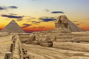 Female Figure In Mythology Prints: The Sphinx and the Pyramids at sunset