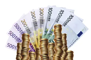 Euro Coin Stack Prints: Stack of coins in front of a fan of banknotes