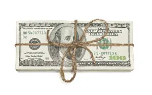 White Background Money Stack Prints: Stack of one hundred dollar bills tied in a burlap string isolated on a white background
