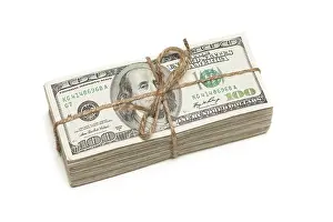 Isolated Dollar Bills Prints: Stack of one hundred dollar bills tied in a burlap string isolated on a white background