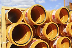 Deserted Construction Area Germany Prints: Stack of KG pipes on a construction site in the Mutterstadt development area