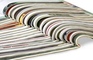 Bright White Background Cutout Prints: Stack of magazines isolated on white background