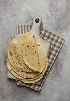 Top Down Perspective Prints: A stack of Mexican tortillas, on a gray table