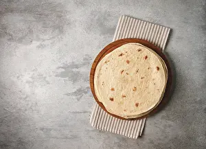 High Calorie Baked Goods Prints: A stack of Mexican tortillas, on a gray table