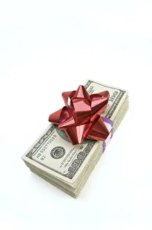 Money Pile Prints: Stack of money with bow isolated on a white background