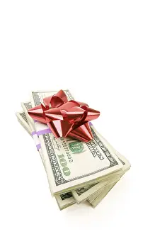 Deserted Cash Pile Prints: Stack of money with bow isolated on a white background