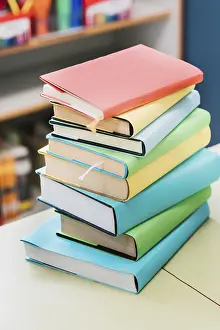 Educational Institution Background Prints: Stack multicolored books table