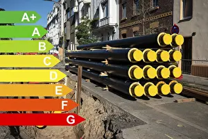 Environmental Pollution Reduction Prints: A stack of new pipes for district heating at a construction site