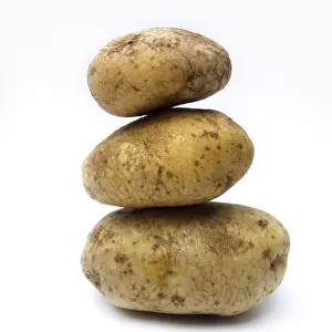 Empty Kitchen Scene Prints: A stack of organic potatoes on white background