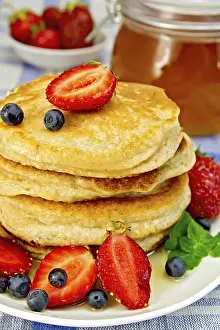Homemade Desserts Prints: A stack of pancakes with strawberries