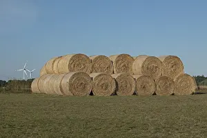 Sustainable Energy Supply Prints: Stack of round bales, straw, wind turbines