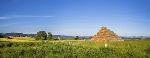 Rural Countryside View Prints: Stack of straw bales on field of grass