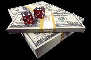 Black Background Studio Photography Prints: Stack of ten thousand dollar piles of one hundred dollar bills & dice on a black backgro Stack of ten thousand