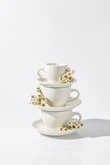 Spring Flowers Arrangement Prints: Stack of white ceramic cups with small spring flowers adorning each