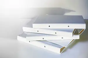 Office Work Concept Prints: Stack of white file folder or ring binder waiting to be processed in an office