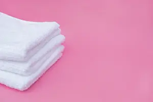Macro Photography Prints: Stack white towels pink background