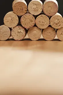 Uninhabited Winery Scene Prints: Stack of wine corks on a wood surface