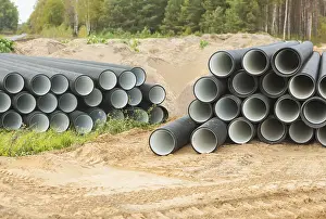 Deserted Construction Site Prints: Two stacks of pipes