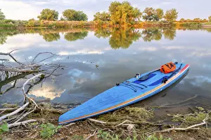 Stand Up Paddleboard Prints: Stand up paddleboard with a paddle