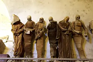 Catacombe Dei Cappuccini Prints: Six standing mummies side by side