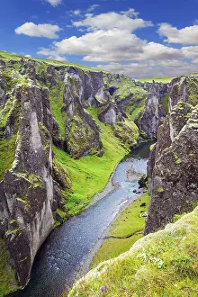 Iceland Travel Photography Prints: Steep vertical cliffs surround the stream of very cold water