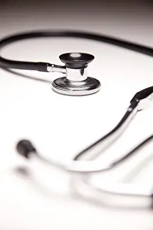 Shallow Depth Of Field Image Prints: Stethoscope on gradated background with selective focus