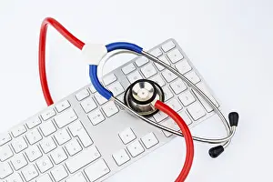 Symbolic Stethoscope Image Prints: Stethoscope and keyboard of a computer