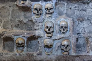 European Stone Structures Prints: Stone structure embedded with human skulls