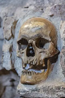 Eastern European Rock Formations Prints: Stone structure embedded with human skulls