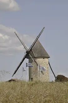 Deserted Windmill Prints: A stone windmill under a blue sky with clouds