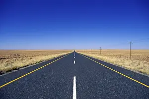 Desert Road Prints: Straight tarroad in Namibia