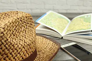 Central Europe Map Prints: Straw hat, guide book with map